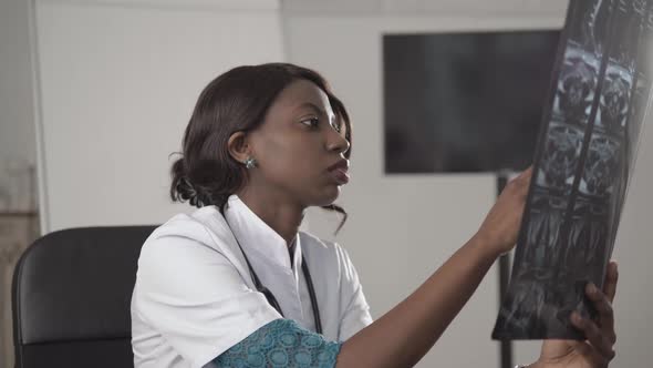 Beautiful African American Healthcare Worker with X-ray, Medical International Concept, Black Doctor