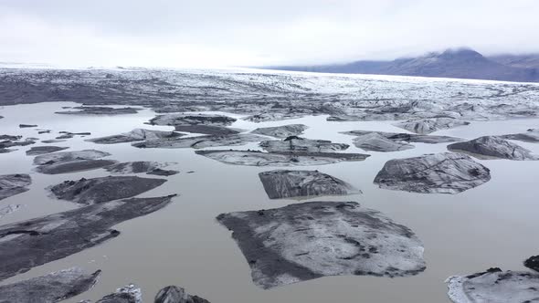 Flying Over Melting Icebergs in Svinafellsjokull Glacial Lake, Iceland