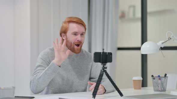 Video Recording on Smartphone By Young Redhead Man 