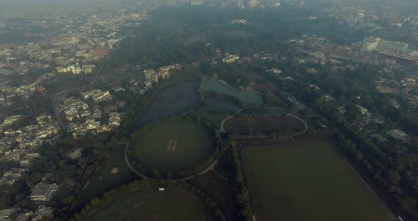 Bombay, India, Aerial flight going to the horse riding ground and trraining areas, a pond with the p