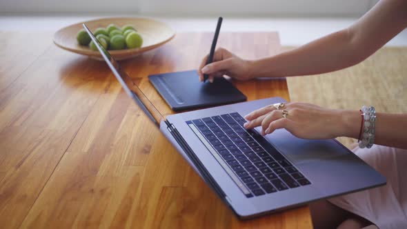 Female Hands Working on Computer and Drawing Pad