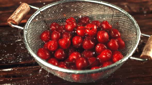 Super Slow Motion on the Cherry in the Colander Drop Drops of Water