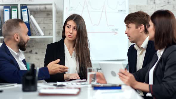 Smiling Stylish Business People Having Friendly Communication at Team Meeting in Modern Office