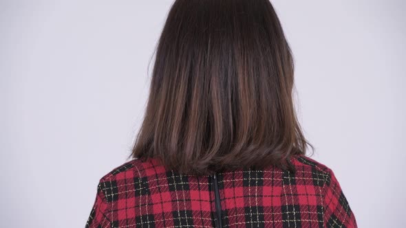 Rear View of Young Beautiful Asian Businesswoman Looking Back