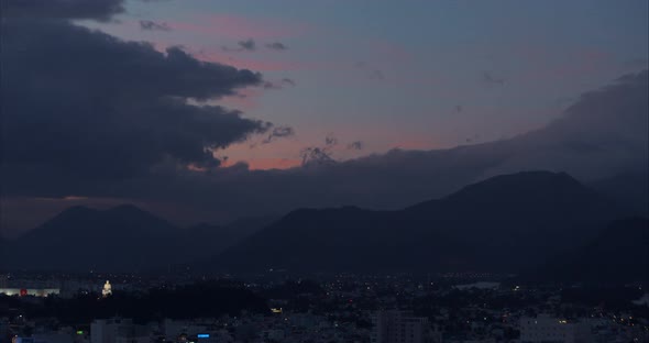 City Timelapse of Sunset Over City with Few Clouds in the Sky and Orange Teal