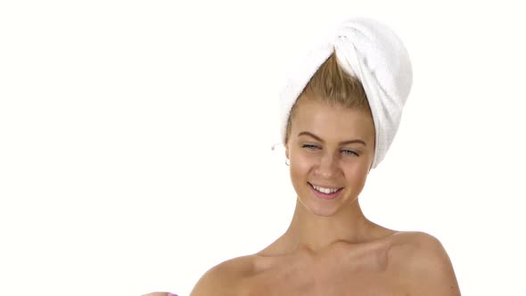 Woman with a Towel on Her Head Takes Selfie. Close Up, Bathroom