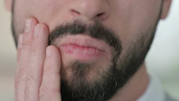 Close Up of Young Man with Cavity Toothache