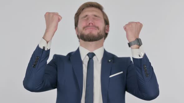 Disappointed Young Businessman Reacting Loss on White Background