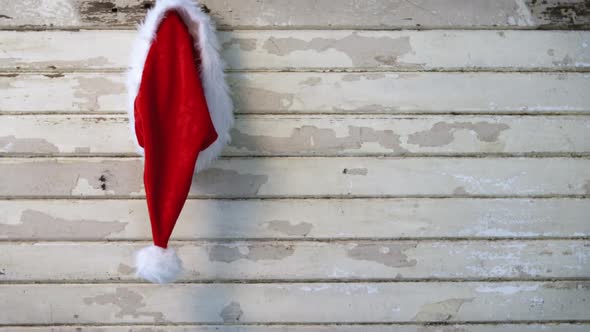 Santa hat hanging wooden wall