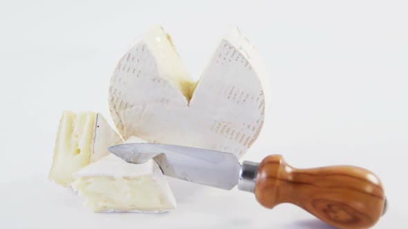 Slice of cheese with knife