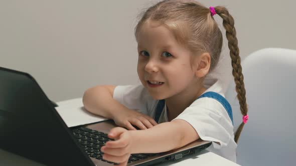 Closeup Portrait of Little Cute Girl with Pigtails