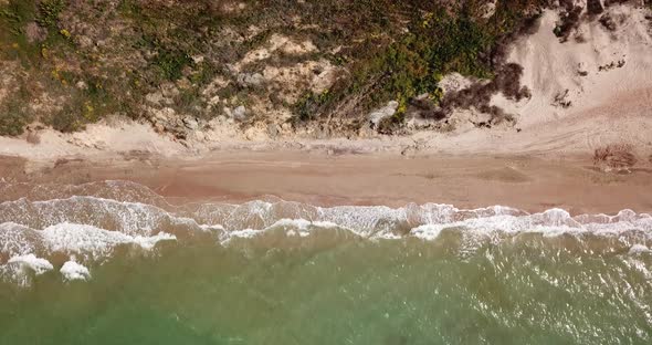 Top Down View of Waves Breaking in the Sand, Flying Over Tropical Sandy Beach and Waves