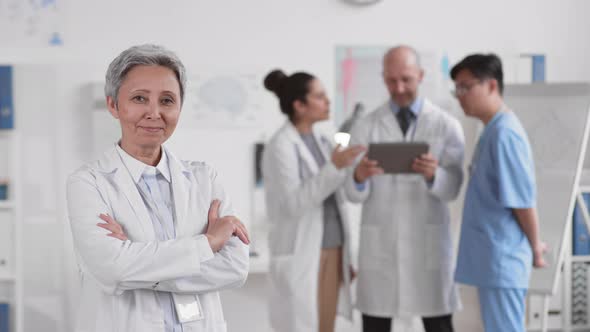 Senior Female Doctor Posing on Camera