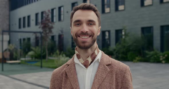 Portrait of Cheerful Man with Beard Looking and Posing To Camera. Crop View of Stylish Male Person