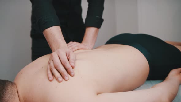 Chiropractic or Physiotherapist Giving Back Massage To Patient, Close Up Slow Motion Shot