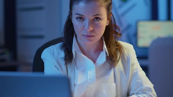 Close Up Portrait of Business Woman Smiling at Camera After Reading Mails