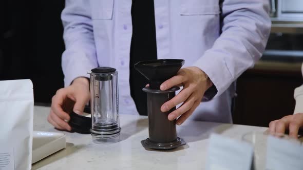 Barista Makes Coffee in Cafe