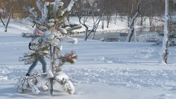 Woman Walk on the Snowy Park