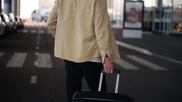 Close Up Cropped Shot of Married Man with the Black Baggage Walking to the Outside Airport Terminal