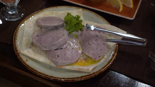 Armenian dish kyufta. slices of boiled minced beef "Kyufta" in restaurant. 