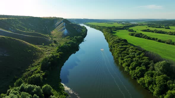 Aerial Video Footage of an Inflatable Boat Floating on the River