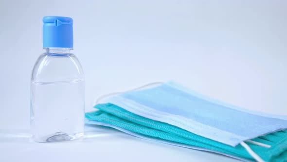 Surgical Masks, and Hand Sanitizer on White Background 