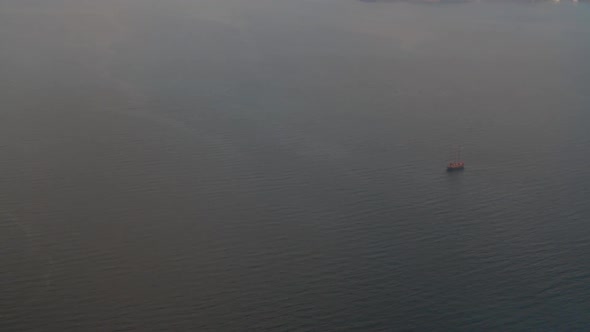 Birds eye view of a tourist ship in the aegean sea. As seen from the high cliffs of the island of Sa