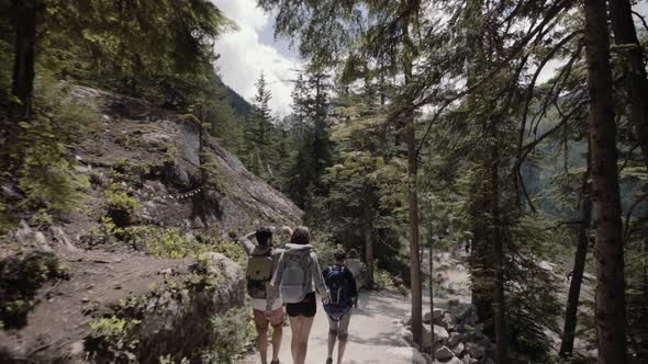 Group of hikers walking down the trail in Canadian wilderness