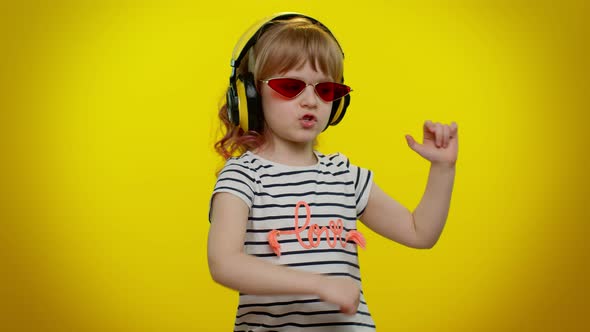 Funny Playful Blonde Child Kid Listening Music Via Headphones Dancing Disco Fooling Having Fun Party