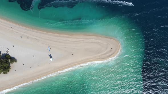 Standing on the golden horn beach in Croatia. Top down shot with a drone.