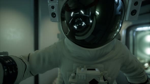 Astronaut Inside the Orbital Space Station