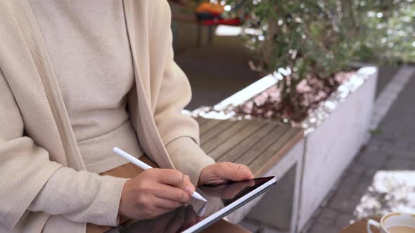 Happy Young Asian Woman Illustrator Drawing Sketches on Digital Tablet