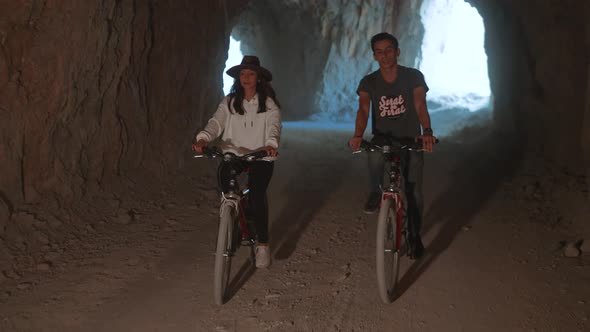 Friends Cycling on Stone Road