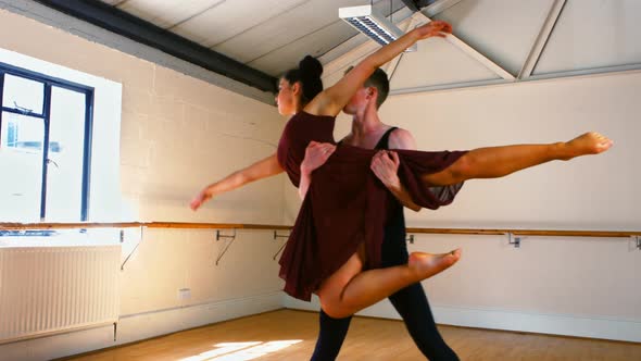 Young couple practicing a ballet dance