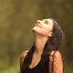 Slow Motion of a Young Beautiful Woman Closes Her Eyes with Pleasure While Enjoying the Summer Rain - VideoHive Item for Sale