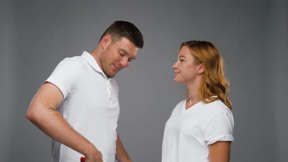 Happy Man Giving Little Red Present To Woman