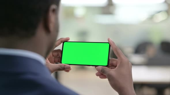 Businessman Looking at Smartphone with Chroma Screen