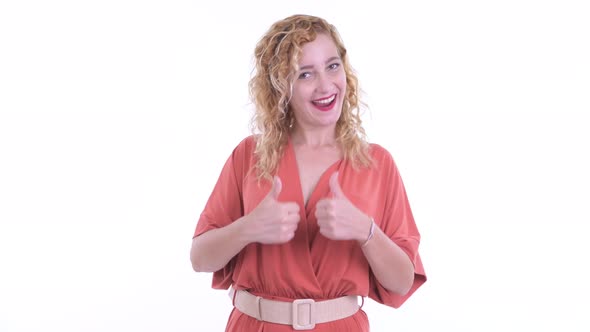 Happy Beautiful Blonde Businesswoman Giving Thumbs Up