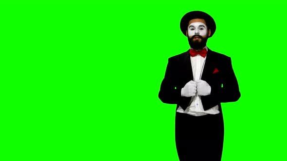 Man Mime Talks To Somebody on Green Screen