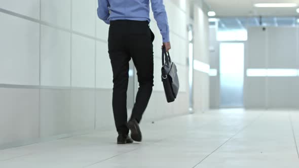 Entrepreneur Walking with Box and Briefcase to New Office