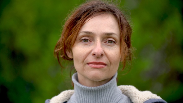 Closeup portrait of an adult beautiful woman outdoors