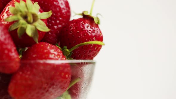 Glass Plate With Ripe Strawberries Rotates