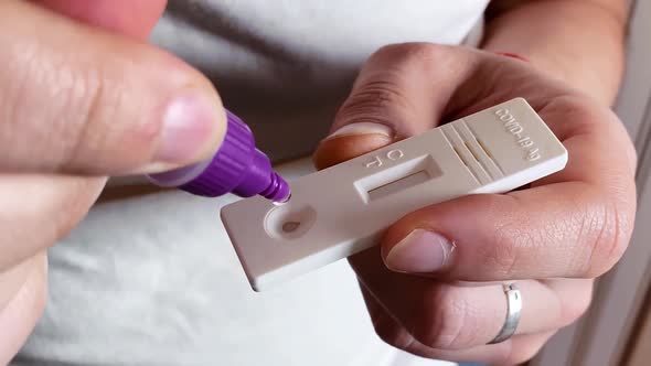 Caucasian Man Doing an Antigen Test for Coronavirus