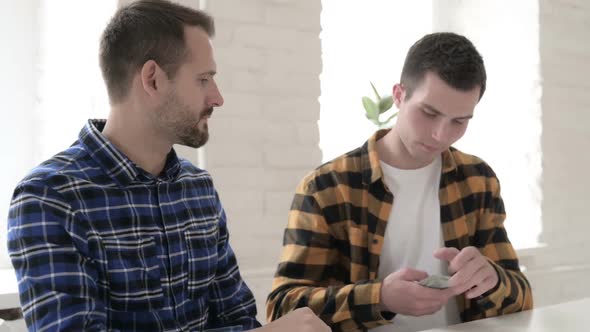 Young Man Giving Money Counting Dollar