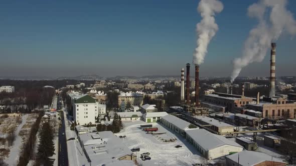 Aerial view of a drone flying over an industrial plant