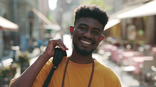 Portrait of Black Man Smiling Sincerely on City Street