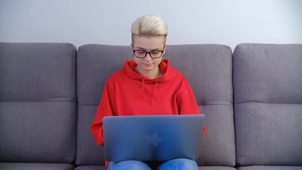 White female studying online with notebook computer and internet connection in 4k video