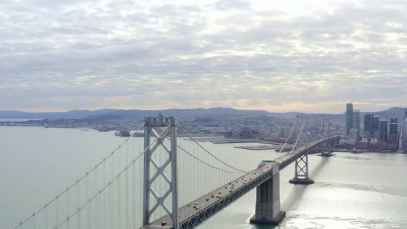 Aerial: scenic view of the bridge, the city and traffc, drone view