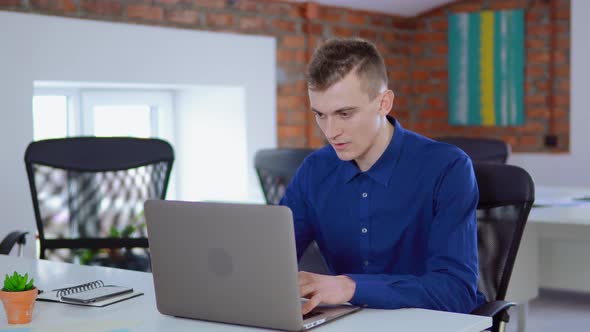 Caucasian Employee Male Celebrate Victory at Workplace