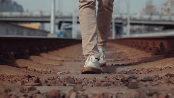 Man Walks To Home On Railroad Tracks After Canceled Public Transport.Tourist Legs Walking On Railway